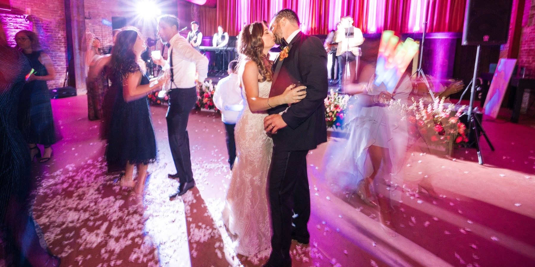 People dance on the dance floor of a Yountville Estate Wedding. Event by Blissful Events. Photo by Lily Rose.