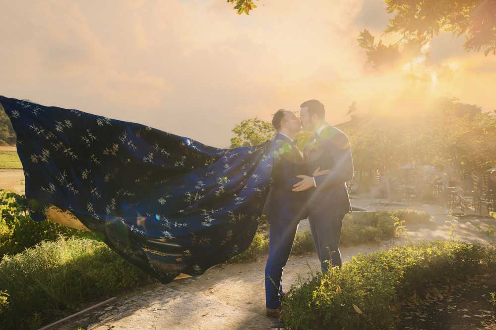 A newly married couple share an outdoor at sunset. Wedding by Blissful Events. Image Captured by Danny Dong Photography.